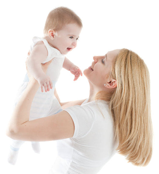 Woman holding a baby against a white background